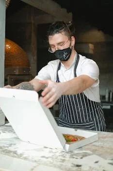 pizza chef working wood fired oven